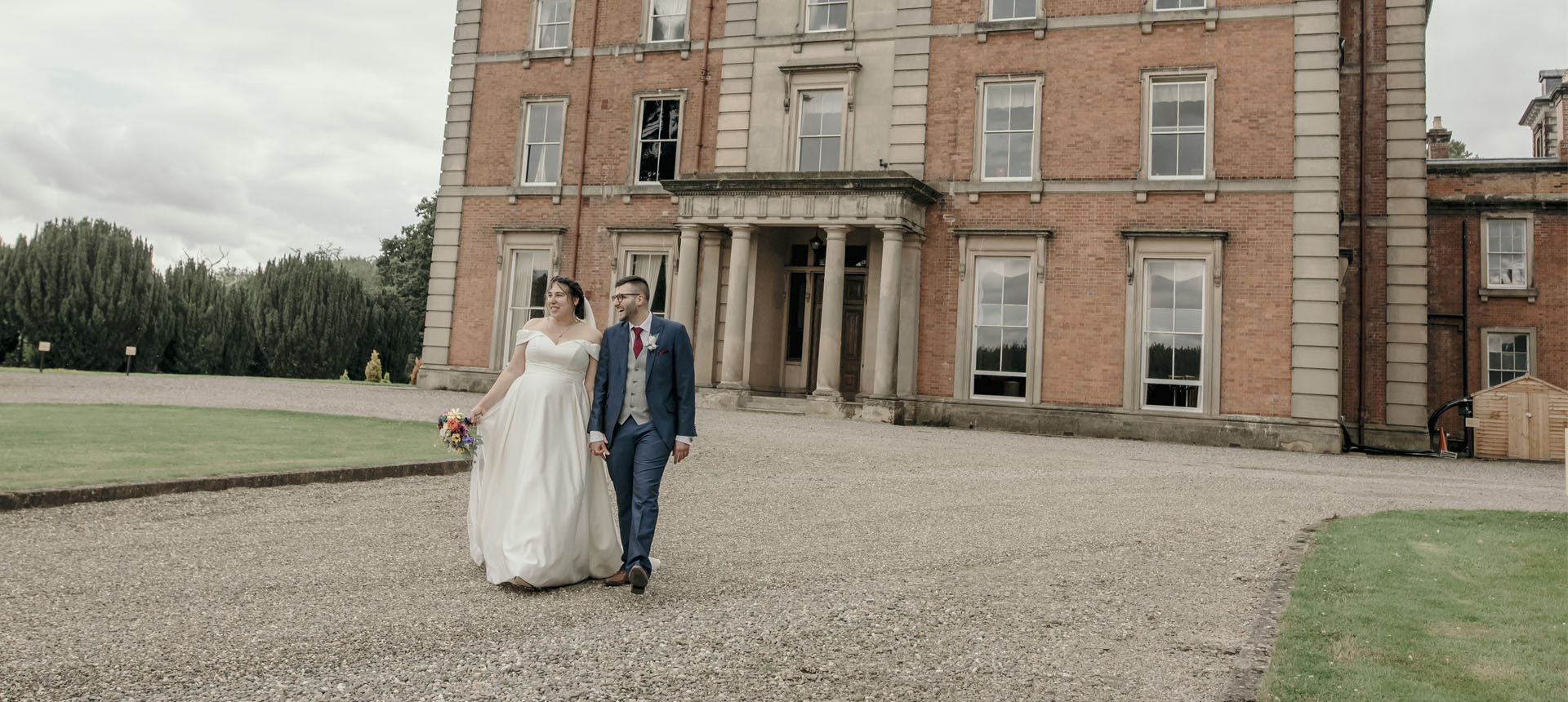 married couple standing outside netley hall